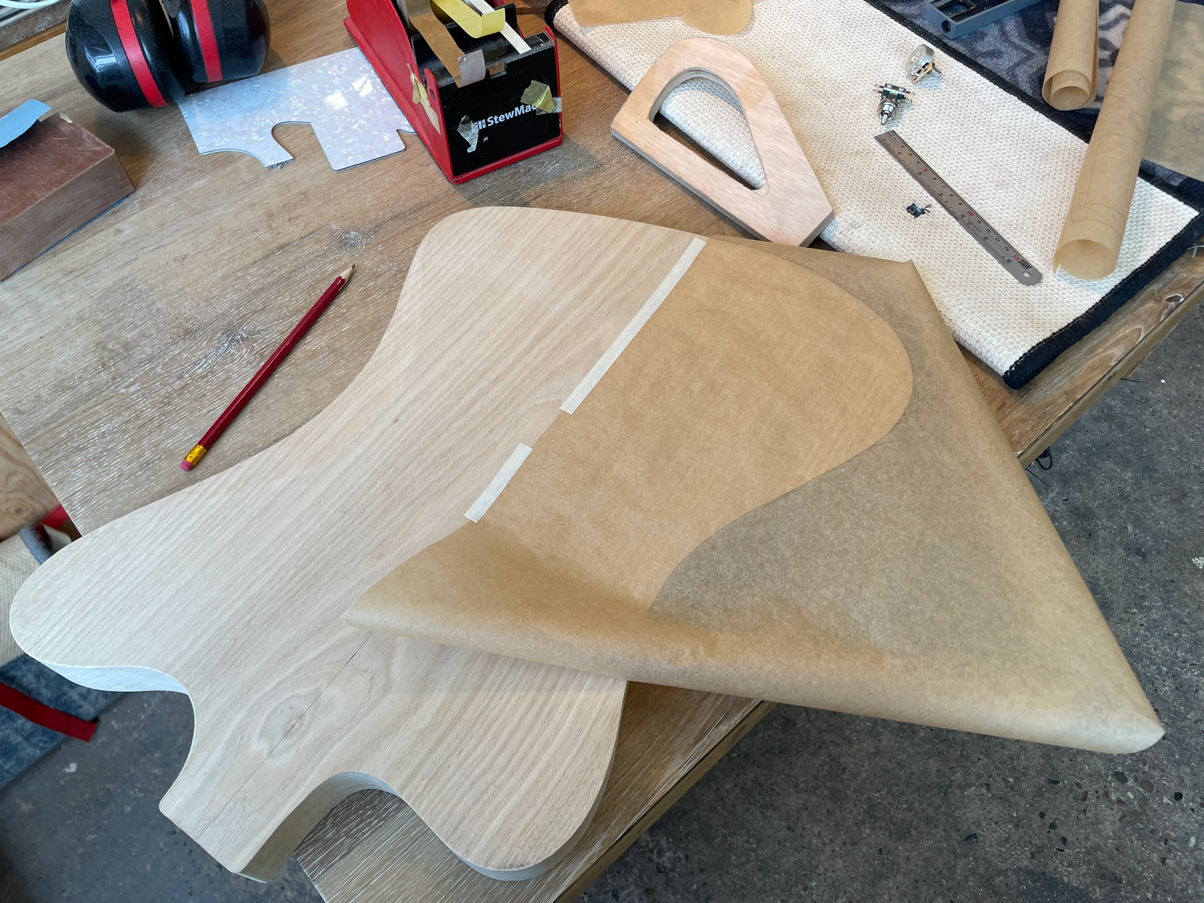 I’m using a template that didn’t have premade cavities (and if I had, I would probably need bigger cavities), so I need to make templates for the cavities. I would ordinarily do this in CAD, and 3d print templates (with PETG and probably solid infill), but no printer in this woodshop. So instead of CAD, I’m using baking paper to trace out the shape of the cavity, and transfer it to plywood that I can then shape on the bandsaw, belt sander, drill press, and oscillating spindle sander. I’m spoiled for tools!