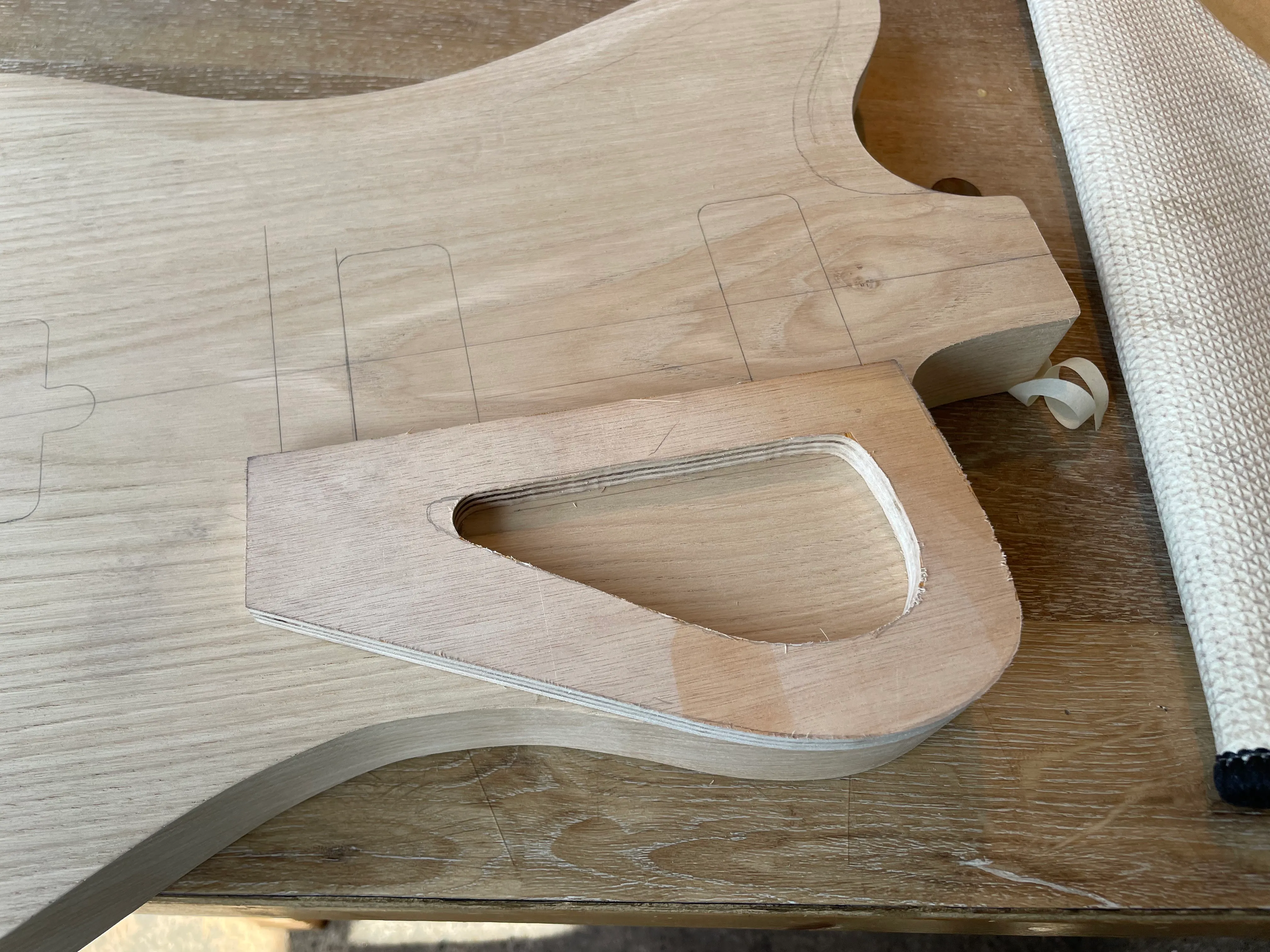 Here’s the template I made for the front control cavity sitting on top of the guitar body.