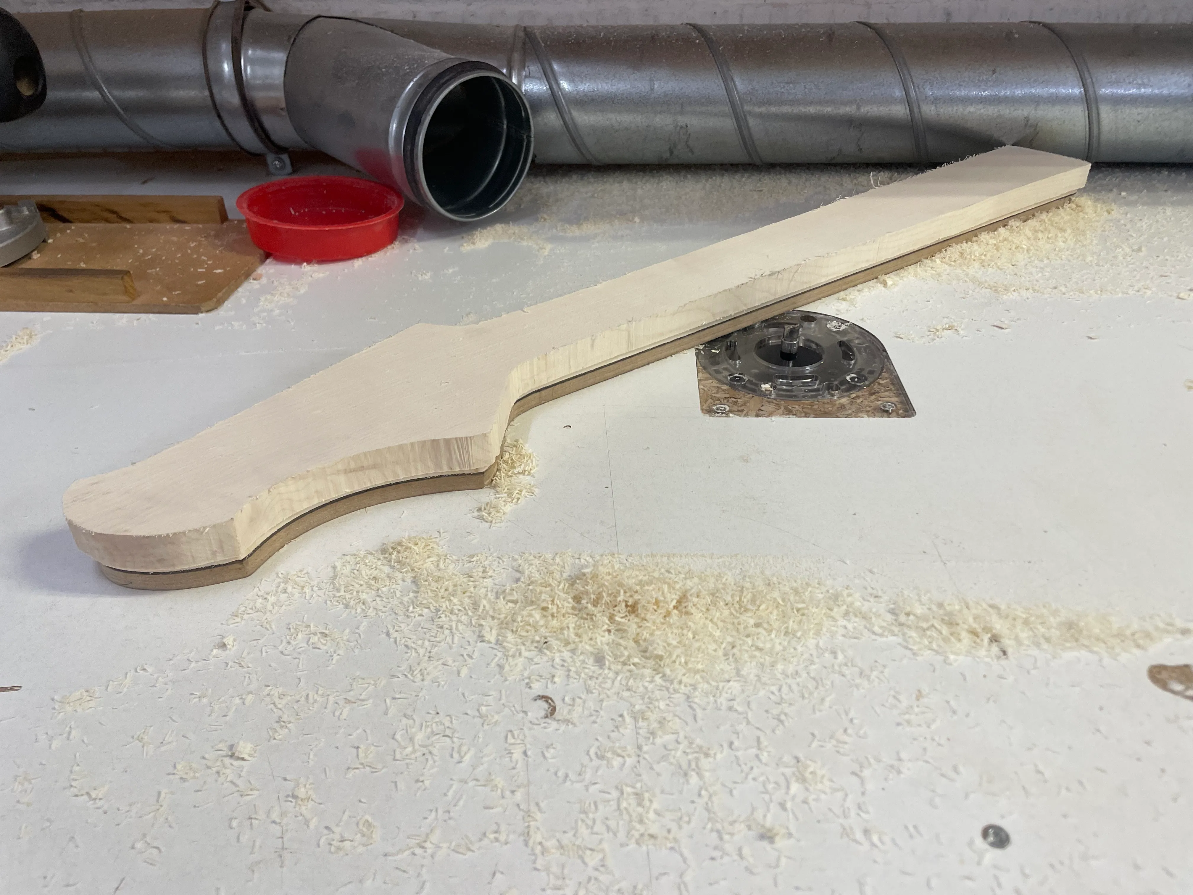 Using a router table and a template to get the neck into shape