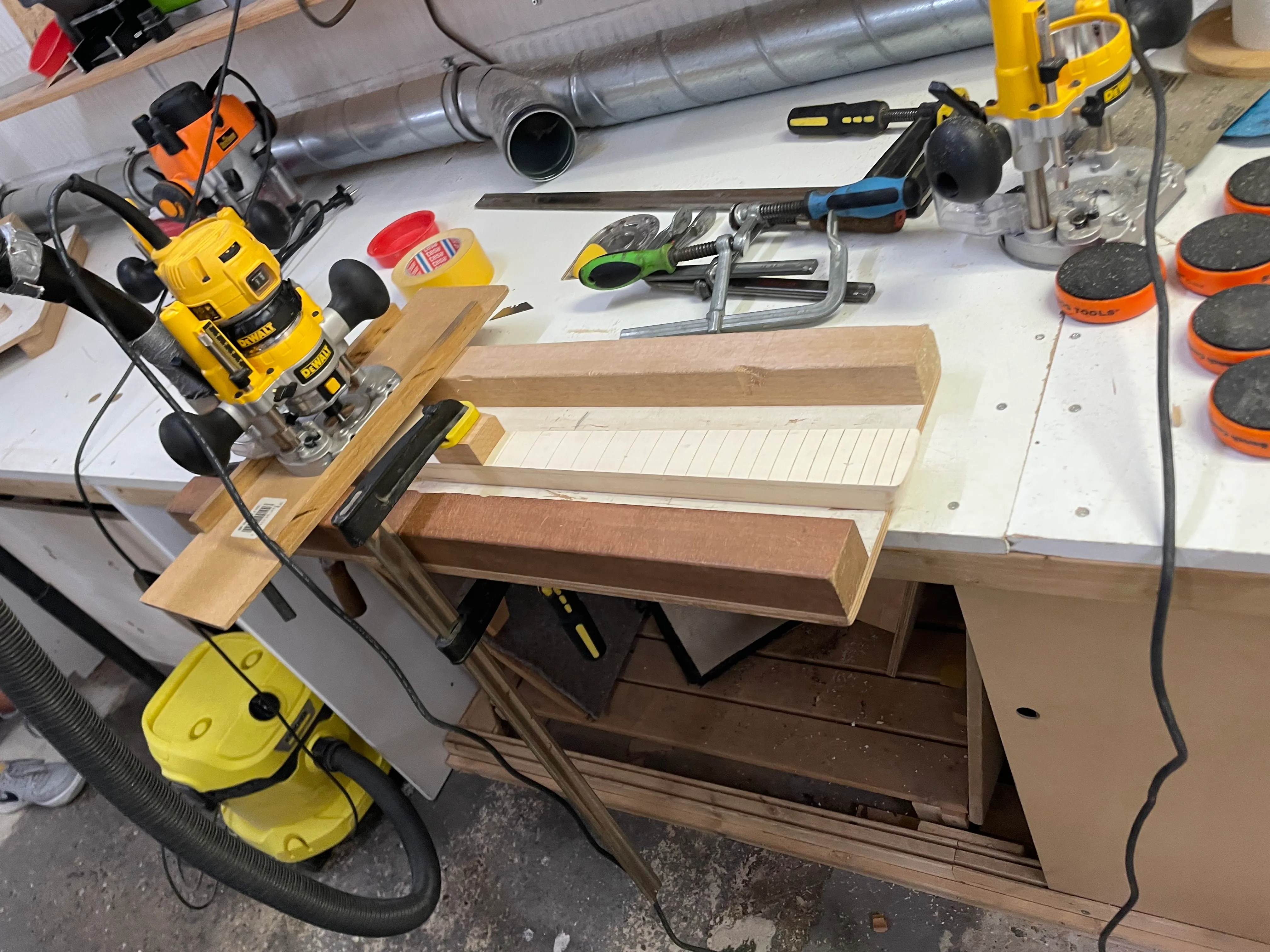 A router and a jig make light work of cutting a taper into the neck before it gets rounded