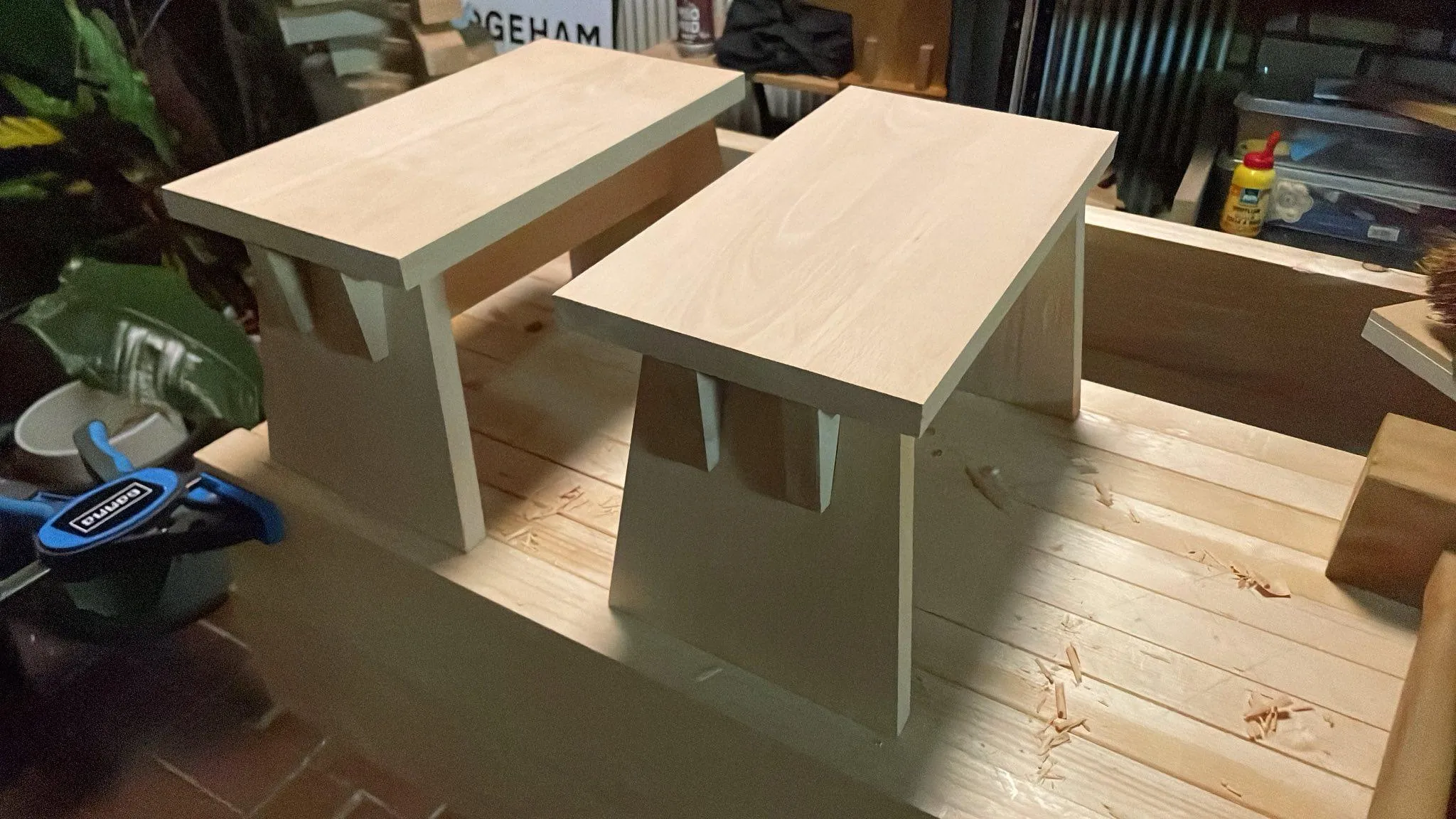 A photo of two step stools atop my workbench
